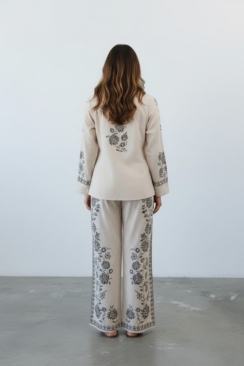 Eclipse The Label ivory linen blend co-ord set with hand-printed botanical motifs on shirt and straight-leg trousers.