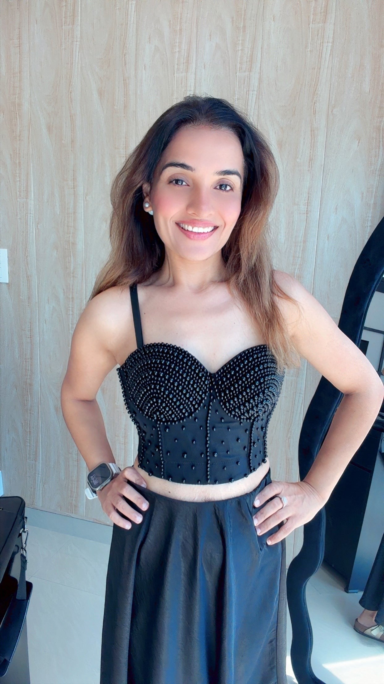 Eclipse-The Label black beaded corset with sweetheart neckline and detachable straps, worn by a woman.