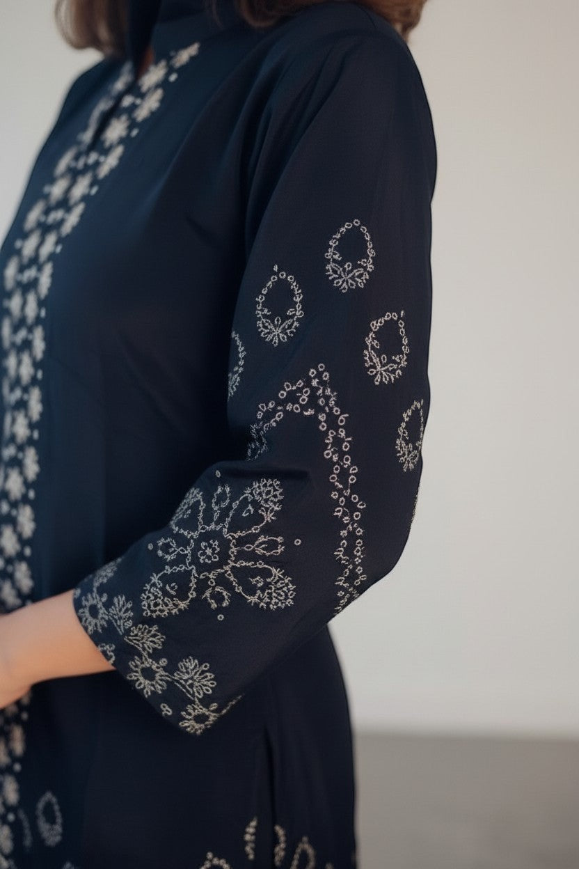 Eclipse-The Label black pure crepe set with crew neck, hand-printed motifs and intricate hand embroidery on sleeves and front.