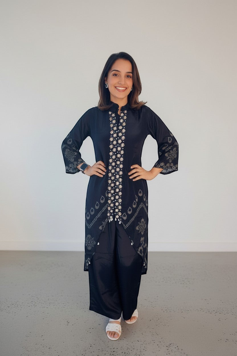 Eclipse-The Label black pure crepe set with crew neck, hand-printed motifs, and intricate hand embroidery on the front and sleeves.