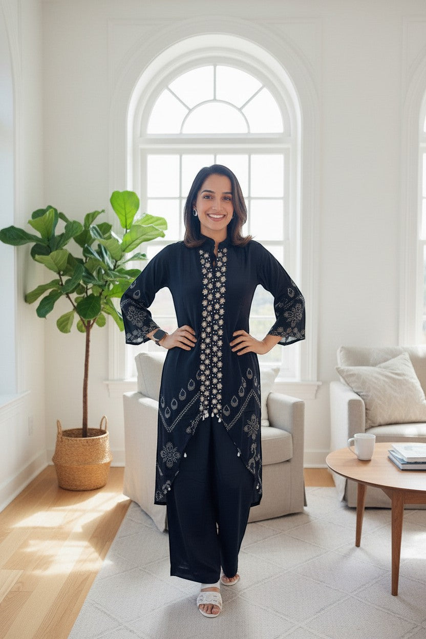 Eclipse The Label black crepe set with crew neck, hand-printed motifs, and intricate hand embroidery on the front and sleeves.