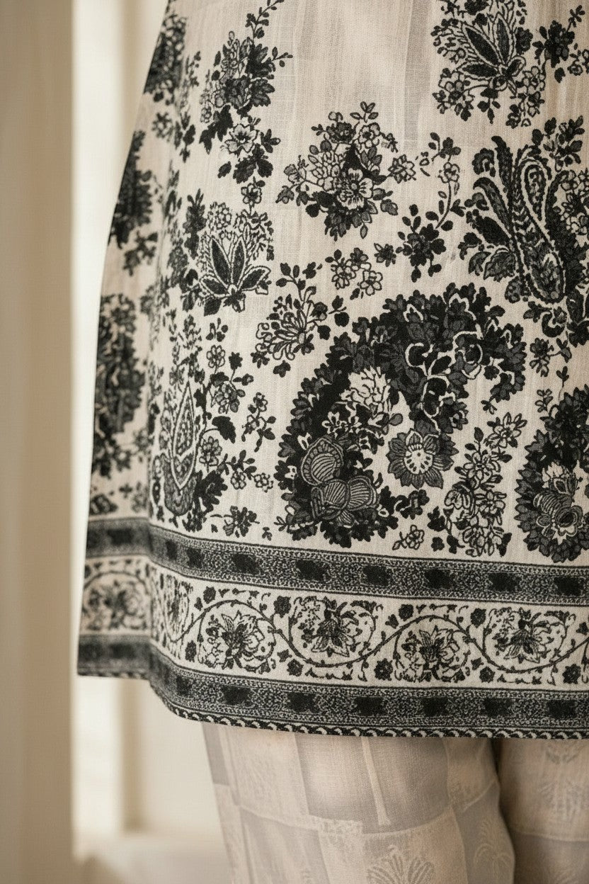 Eclipse-The Label black and white floral print kurta with band collar and matching trousers.