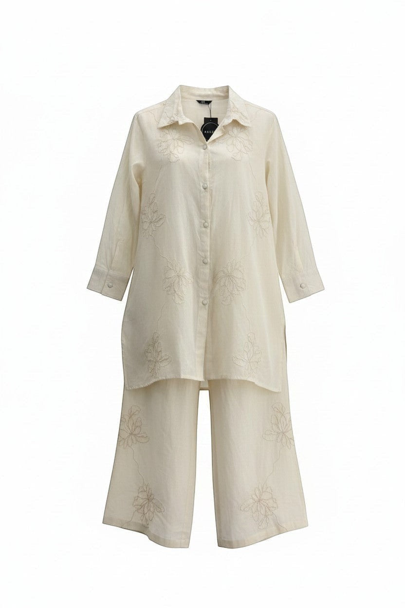 Eclipse-The Label cream linen shirt and palazzo pants set with delicate floral embroidery. Longline shirt with collar and wide-leg pants.