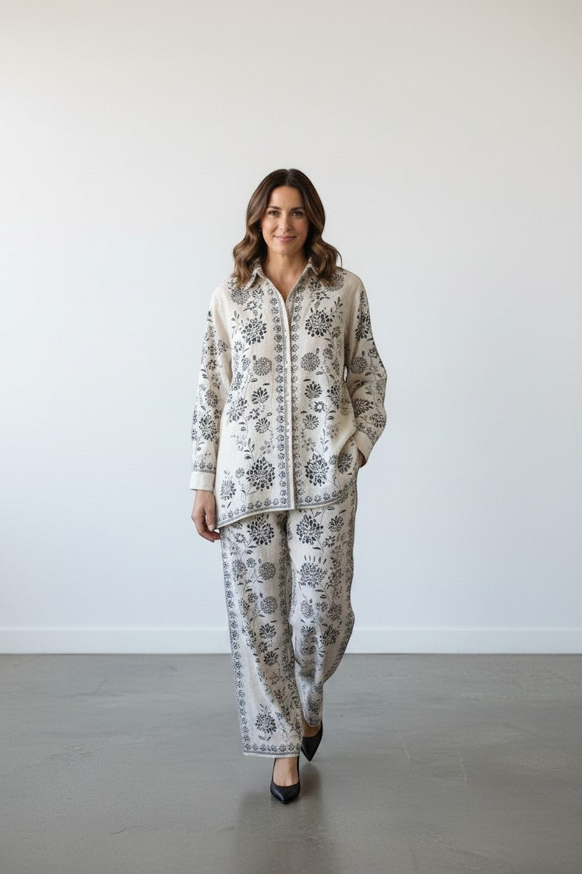 Eclipse The Label ivory linen blend co-ord set with hand-printed botanical motifs. Collared shirt and straight-leg trousers.