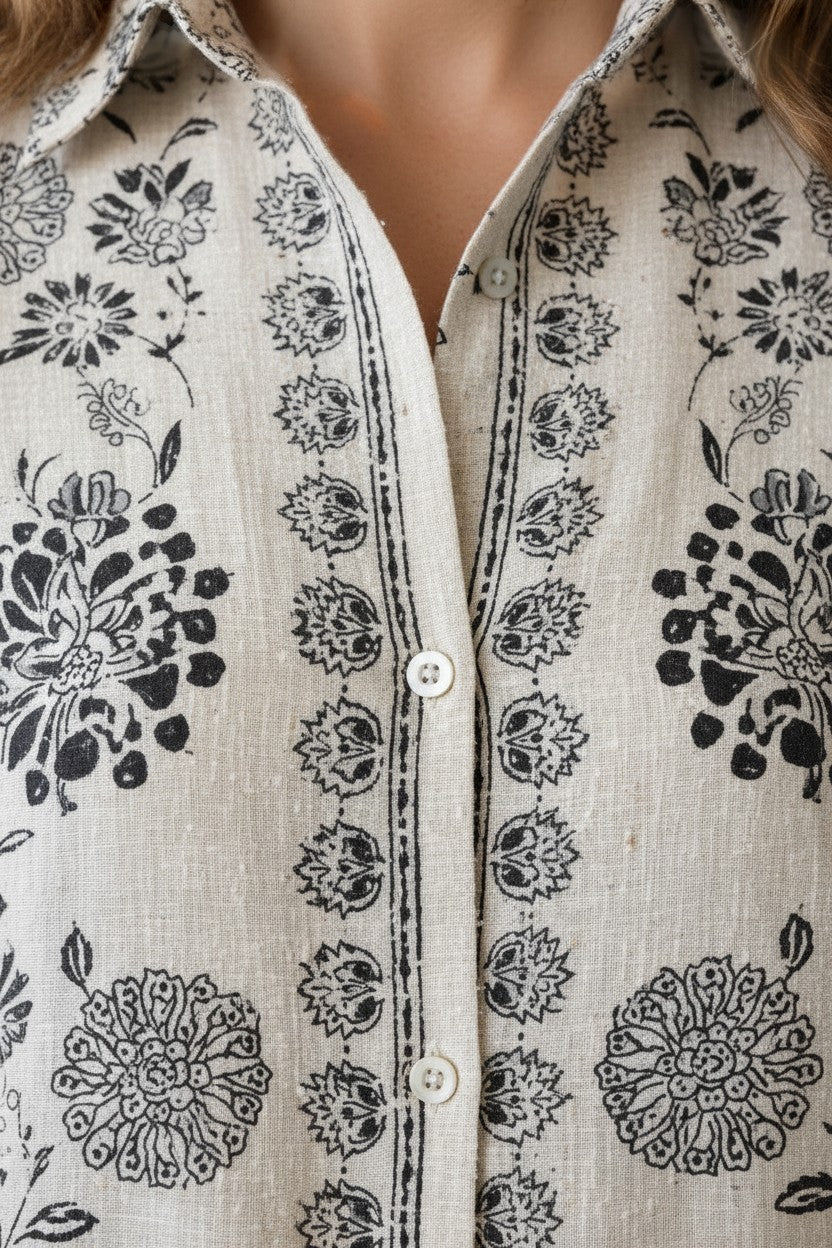 Eclipse-The Label ivory cotton-linen blend co-ord set with hand-printed black botanical motifs, collared shirt and straight-leg trousers.