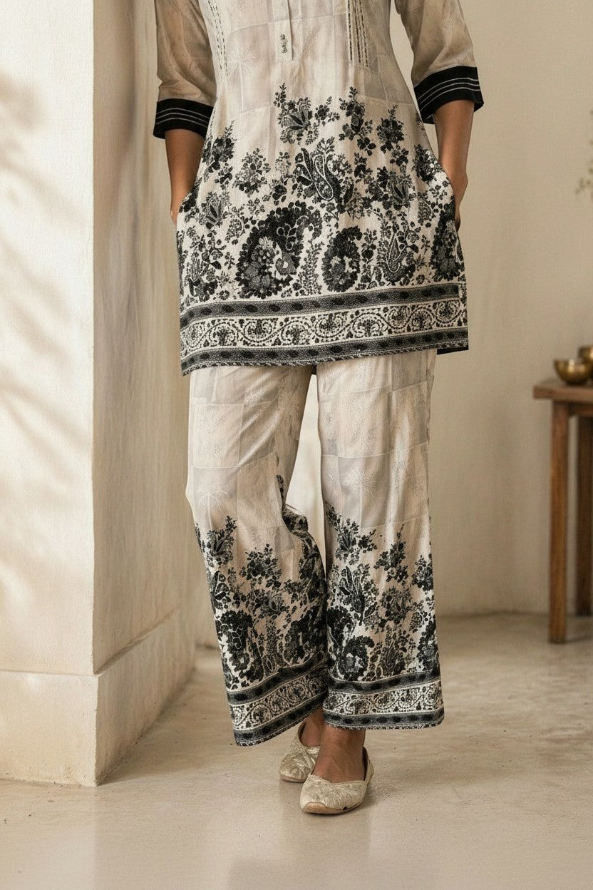 Eclipse-The Label cream and black floral print kurta and trouser set with band collar and button-down front.